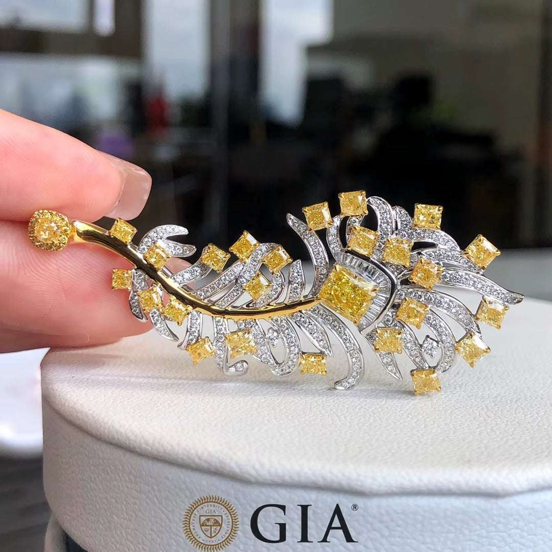 Asphodel’s Dawn 0.73 ct yellow diamond sunburst brooch in 18K white gold with intricate craftsmanship and radiant canary-yellow diamonds