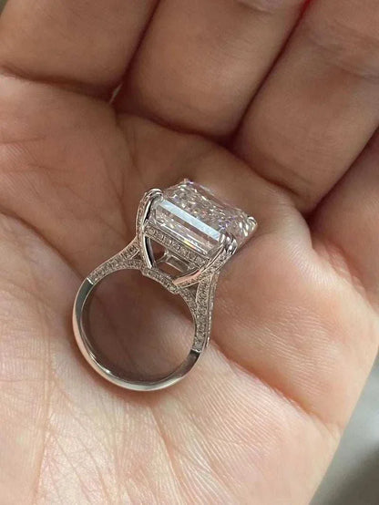 Ruif unique customized 20-carat emerald cut diamond ring with VS1 clarity and F color held in hand