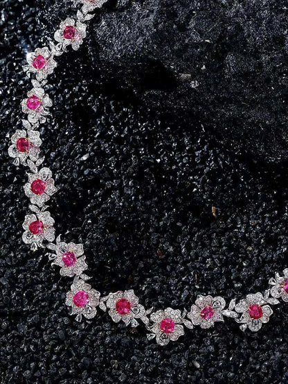 Fine jewelry necklace with 18K white gold, natural spinel, and diamond floral design