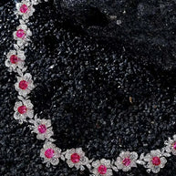 Fine jewelry necklace with 18K white gold, natural spinel, and diamond floral design