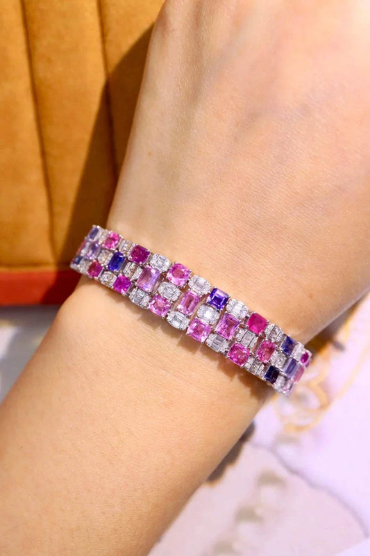 18K gold bracelet with unheated natural pink sapphires and alternating purple and clear gemstones inspired by The Rosefire Legacy