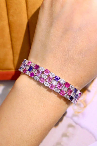 18K gold bracelet with unheated natural pink sapphires and alternating purple and clear gemstones inspired by The Rosefire Legacy