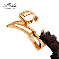 Close-up of gold push-back clasp and brown leather strap on HAOFA 18K gold double-tourbillon skeleton watch strap