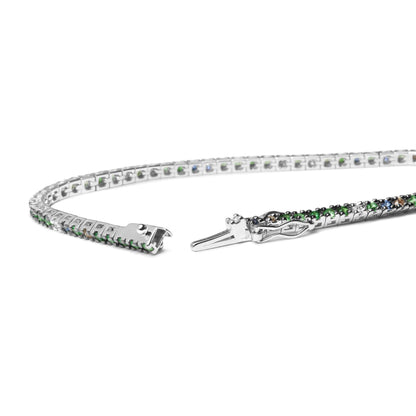 18K white gold tennis bracelet with blue sapphires, green tsavorite gemstones, and 3/8 CTTW diamonds in prong settings