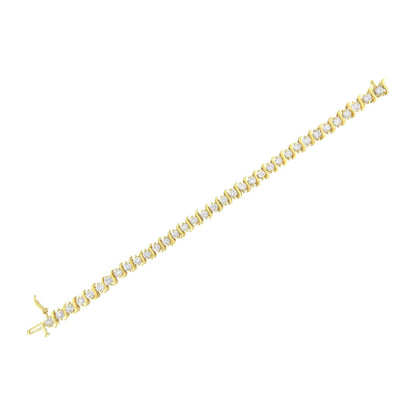 Prong set round brilliant cut diamond S-link bracelet in 10K yellow gold coated sterling silver.