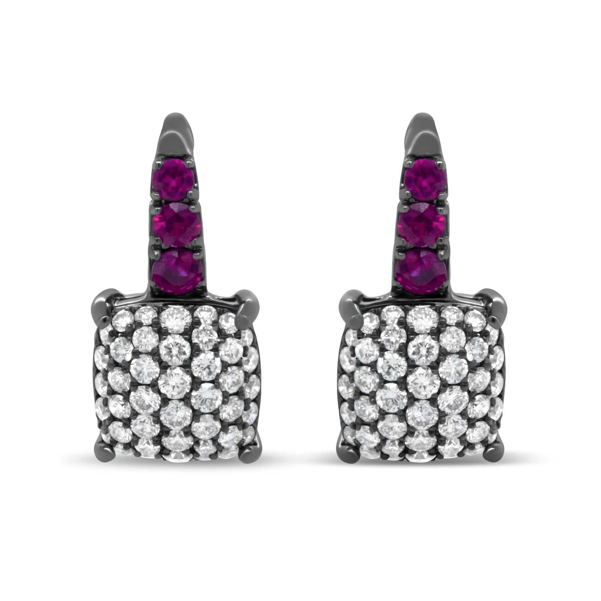 Round diamond and graduated red ruby drop earrings in black rhodium plated 18k white gold with lever backs.