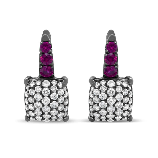 Round diamond and graduated red ruby drop earrings in black rhodium plated 18k white gold with lever backs.