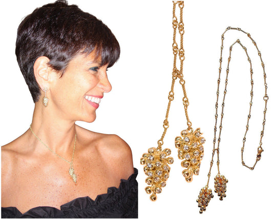 Woman wearing 14K gold grapes necklace with diamonds in lariat style and matching earrings, detailed grape cluster pendants on handmade chain