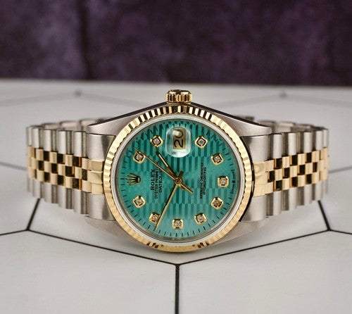 Date-just of the Azure Aegis luxury watch with blue dial, gold and steel Jubilee bracelet, and date display at 3 o'clock.
