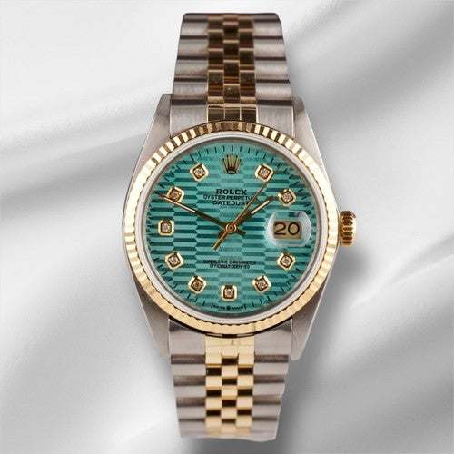 Rolex Date-just of the Azure Aegis watch with blue patterned dial, gold and steel Jubilee bracelet, and date display at 3 o'clock.