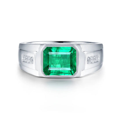 Solid 18k white gold men's ring with natural emerald and diamond accents, emerald cut design