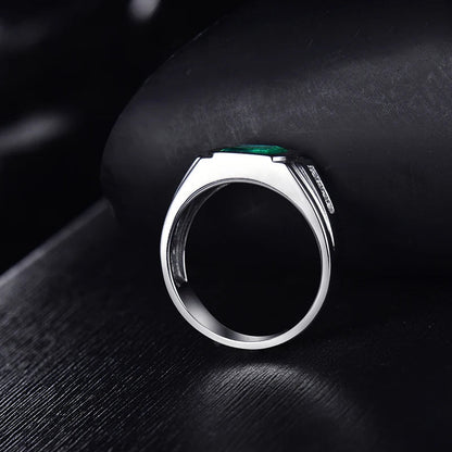 Solid 18k white gold men's ring featuring a natural emerald and round diamonds for engagement or eternity gift