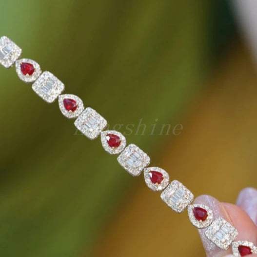 Pear shape ruby and baguette diamond square bracelet with alternating red pear-shaped rubies and sparkling diamond squares