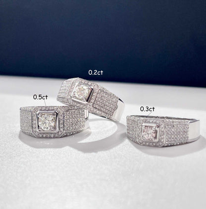 Set of three exquisite paved bling wedding men rings with sparkling stones and different carat sizes on a white surface