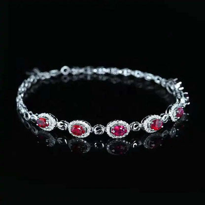 SGARIT 18K white gold vintage bracelet with 2.45CT red ruby and diamond accents on black background