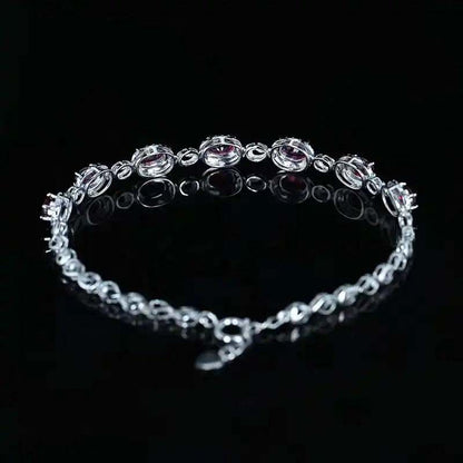 SGARIT 18K white gold vintage bracelet with 2.45CT ruby and diamond accents on black background