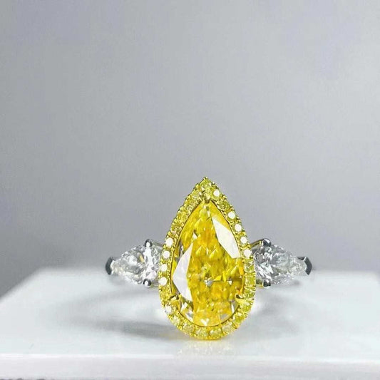 SGARIT Wholesale Jewelry 18K white gold ring with 1.37CT pear cut VS fancy yellow diamond and two white side stones