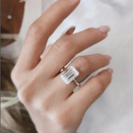 Eternity Prism 5ct emerald-cut diamond ring on hand with silver band