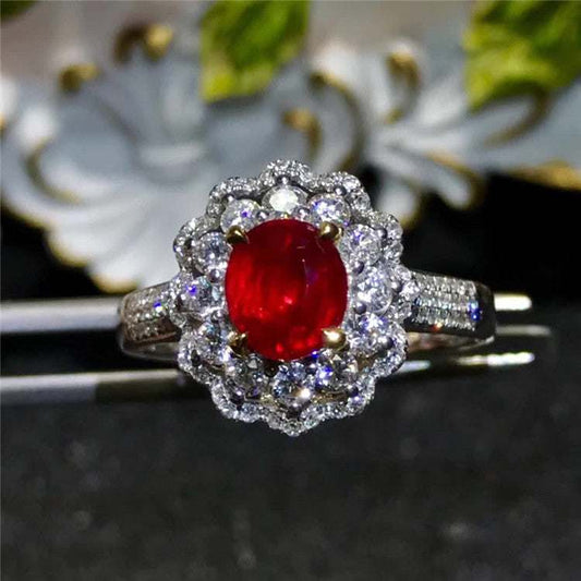 SGARIT AU 750 18kt gold engagement ring with 1.53 carat red ruby and diamond accents