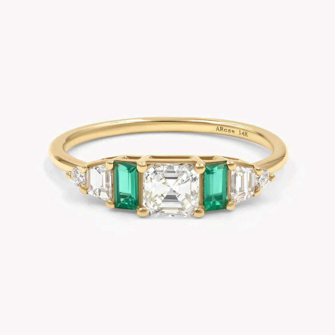 Hall of Emerald Ring featuring 14k yellow gold band with Asscher-cut diamond center and rectangular emerald accents