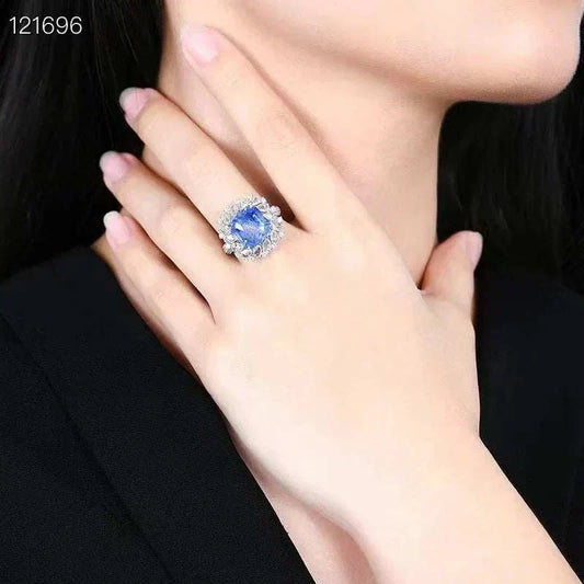18K gold ring with large diamonds and 8.24 carat Sri Lanka natural royal sapphire on woman's hand