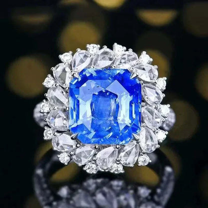 18K gold set ring with large diamonds and 8.24 carat natural royal blue sapphire from Sri Lanka