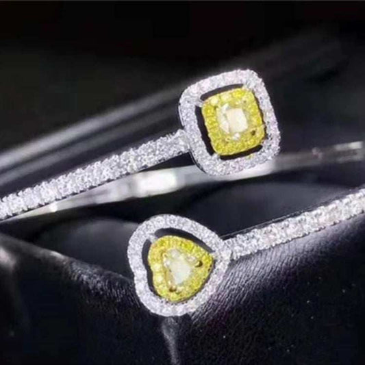 18k gold bangle bracelet with natural yellow diamond charm and white diamond accents
