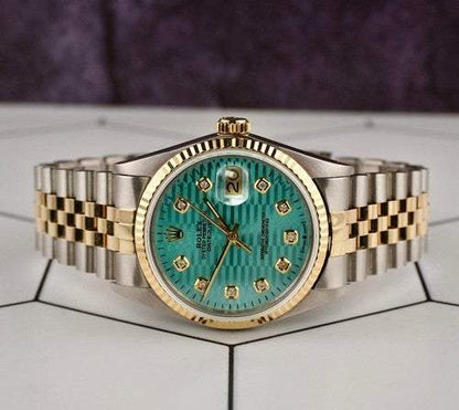 Date-just of the Azure Aegis luxury watch with blue dial, gold and steel Jubilee bracelet, and gold bezel.