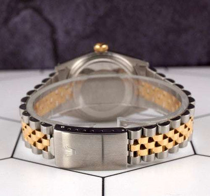 Date-just of the Azure Aegis Rolex watch with gold and steel Jubilee bracelet clasp on tiled surface