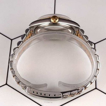 Side view of the Date-just of the Azure Aegis watch with silver and gold Jubilee bracelet and gold crown on a white hexagonal tile background