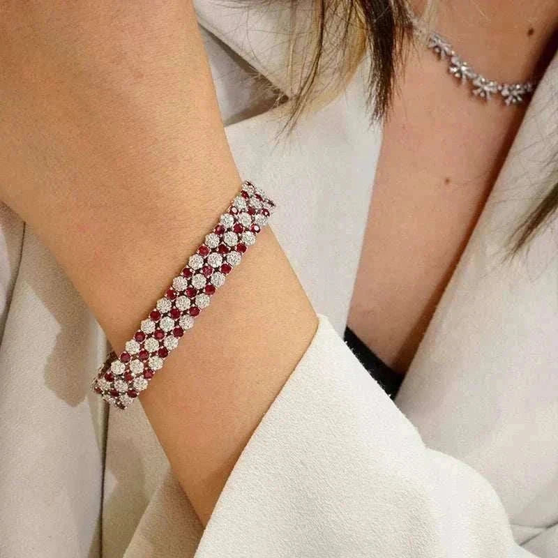 18K white gold tennis bracelet with natural rubies and diamonds on wrist