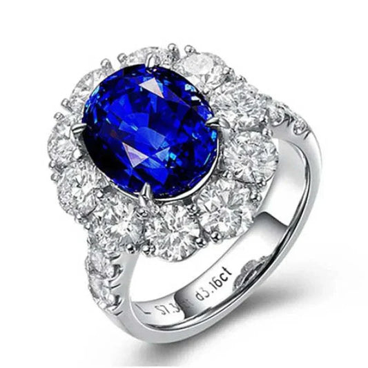 White gold ring featuring a genuine blue sapphire center stone surrounded by sparkling diamonds, the Star of Ithil design symbolizing wisdom and destiny.