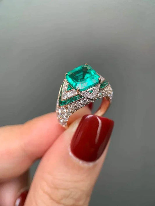 Green Lantern ring featuring a 3.44-carat lab-grown emerald and diamond accents set in 18K gold