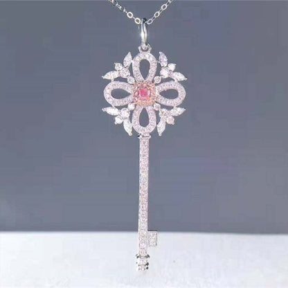 0.13ct natural pink diamond key-shaped pendant necklace in 18k gold with intricate design