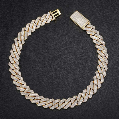 925 Sterling Silver VVS Moissanite Cuban Link Chain Iced Necklace in gold tone with brilliant stones on black background