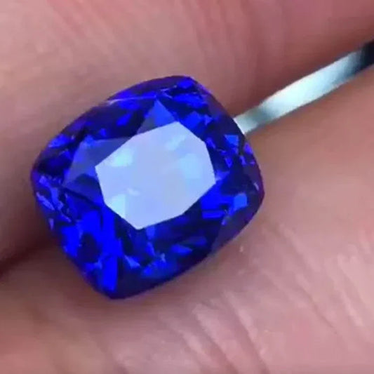 Close-up of a 4.89-carat unheated royal blue sapphire named Celestial Abyss from Sri Lanka, displaying deep velvety blue hues.