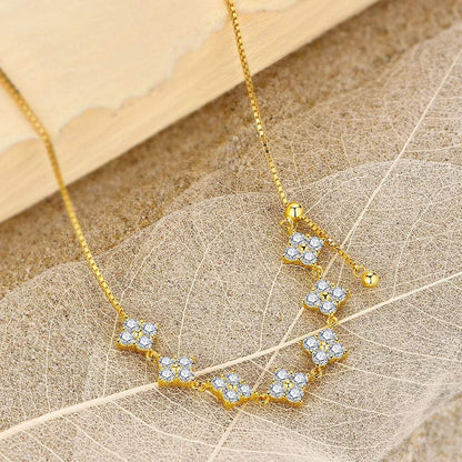 D-Color Moissanite bridal necklace with sterling silver and gold pendant featuring sparkling round moissanite stones on delicate gold chain