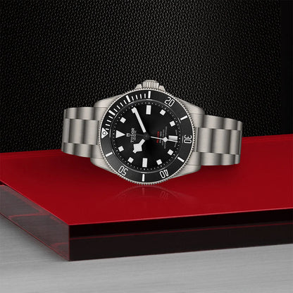 Tudor Pelagos 39 Black Dial watch with titanium case and bracelet on red and black surface