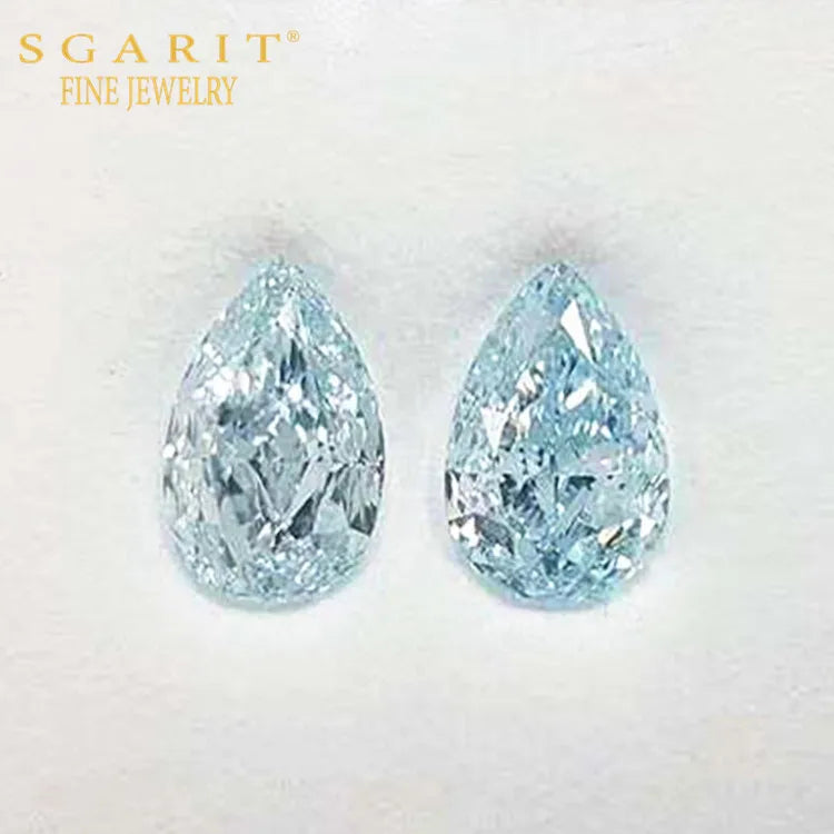 Pair of pear-shaped greenish-blue Naiad’s Tears gemstones with brilliant precision cut and VVS2 clarity by SGARIT Fine Jewelry