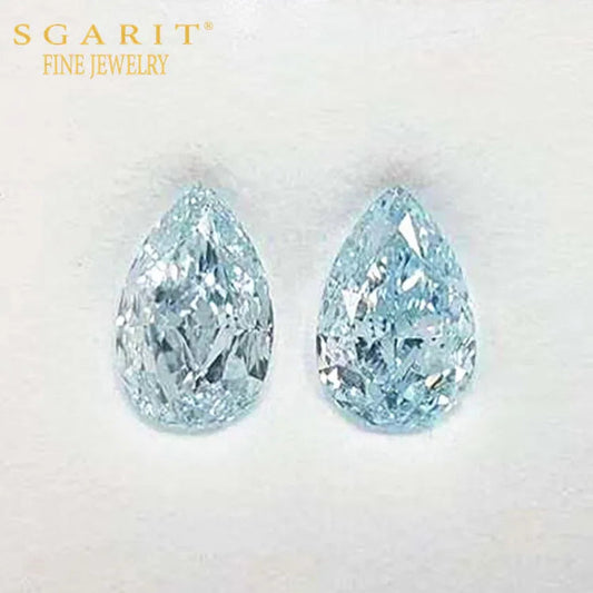 Pair of pear-shaped greenish-blue Naiad’s Tears gemstones with brilliant precision cut and VVS2 clarity by SGARIT Fine Jewelry