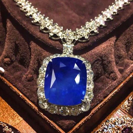 41.33ct Burma cornflower blue sapphire pendant in 18k white gold from SGARIT Rare Collection with diamond halo necklace