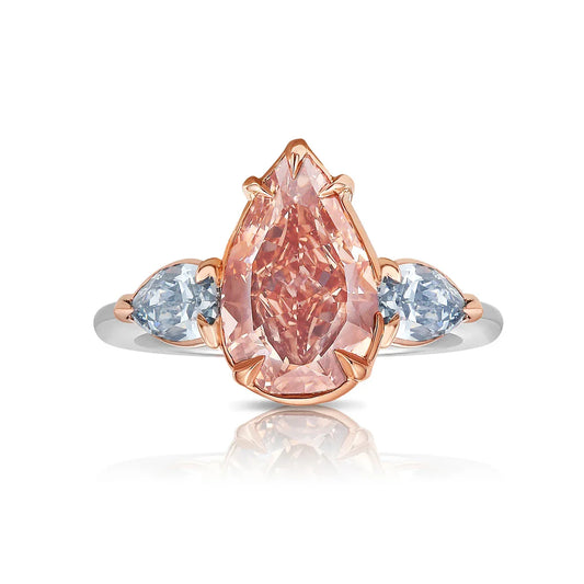 Pink pear diamond three stone ring in white gold with 2.0CT pink lab grown pear-shaped center diamond and two light blue pear-shaped side diamonds
